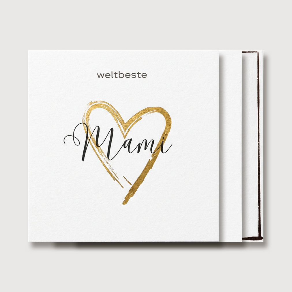 Grußkarte für Mama „weltbeste Mami“ mit goldenem Herz-Schriftzug, leicht schräg fotografiert