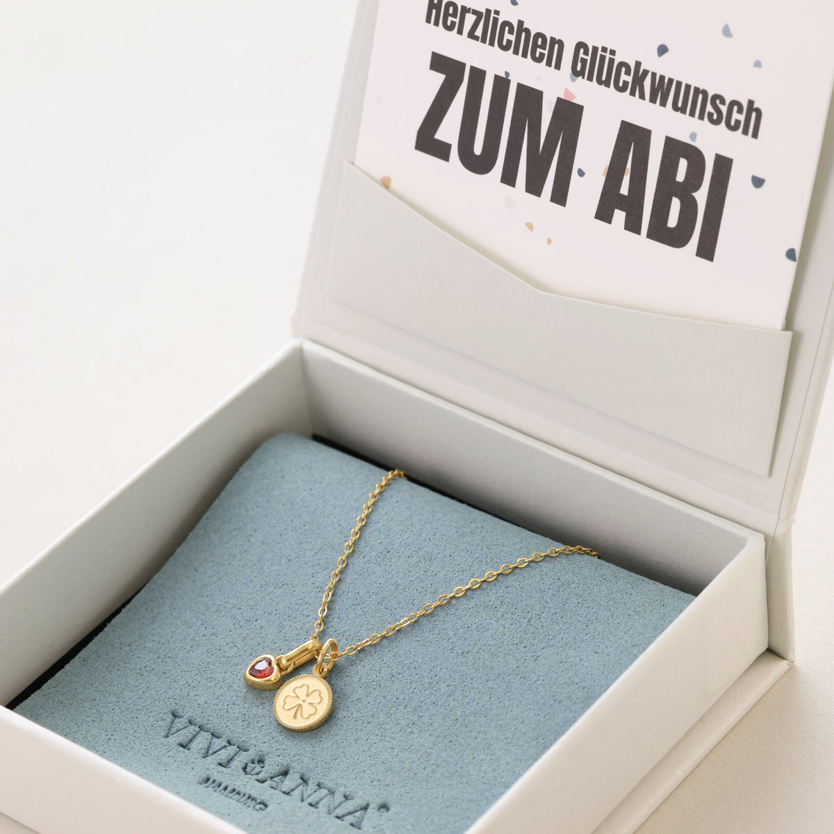 Kleeblatt Halskette in Gold mit Herz-Geburtsstein in Geschenkbox mit Abitur-Grußkarte