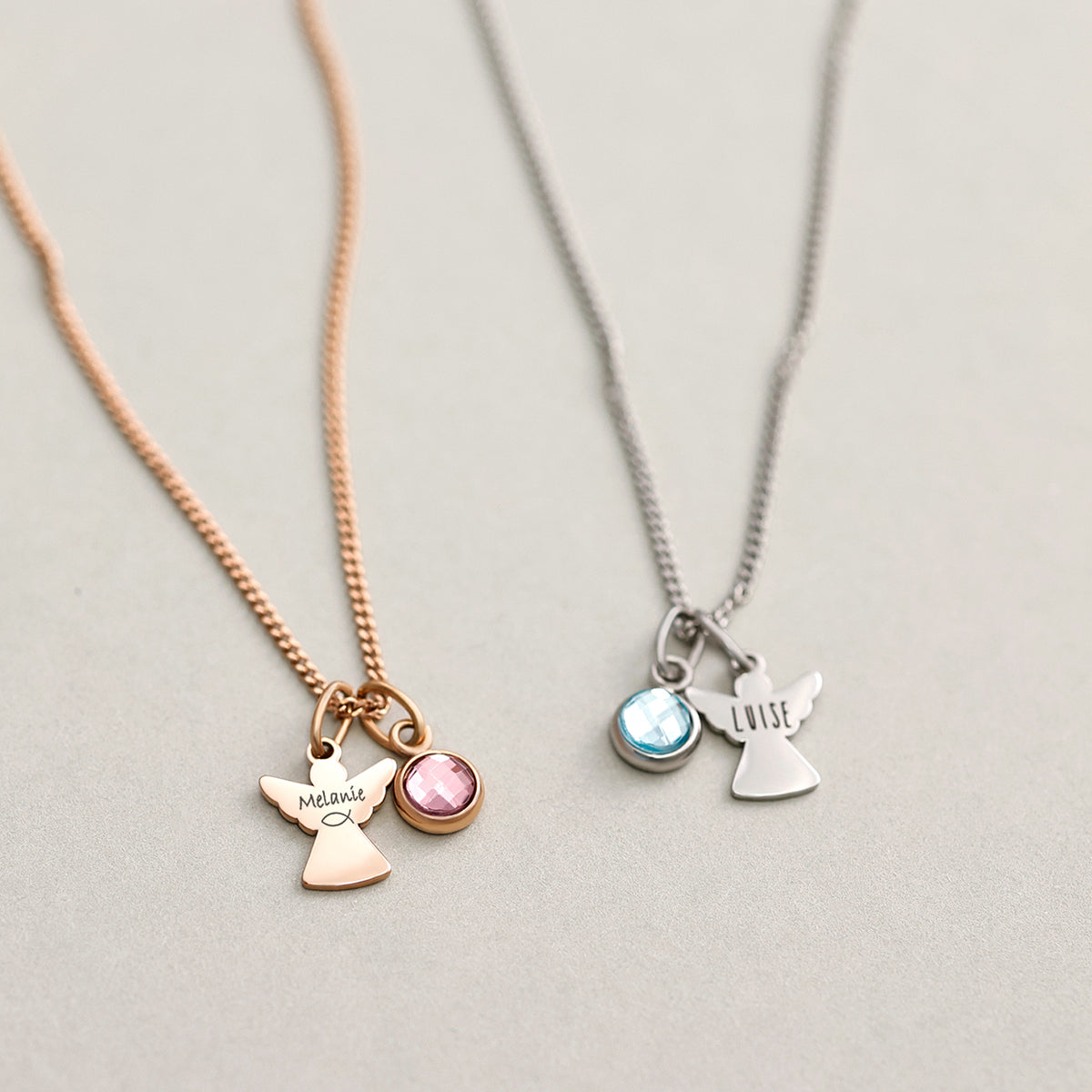 Schutzengel Kette mit Geburtsstein – zwei Engel-Anhänger in Roségold 'Melanie' und Silber 'Luise' im Vergleich