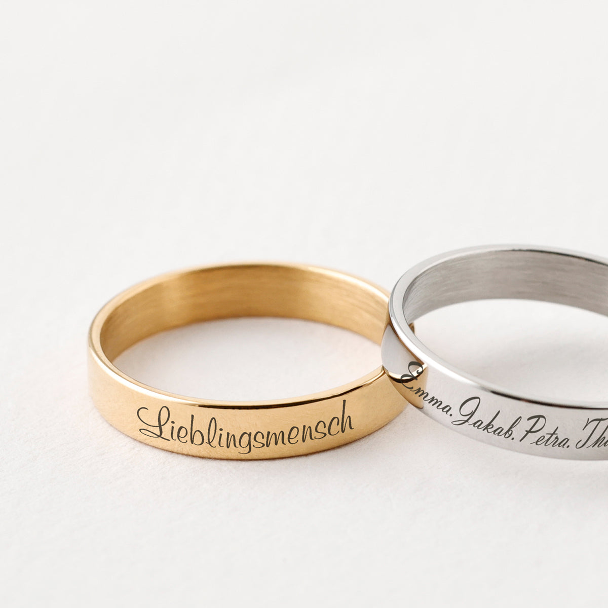 Herren Stapelring mit Gravur in Gold und Silber, graviert mit 'Lieblingsmensch' und Familiennamen
