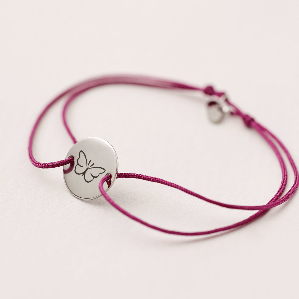Nylon Unisex Armband mit Gravur in Pink, silbernes Plättchen mit Schmetterling-Symbol