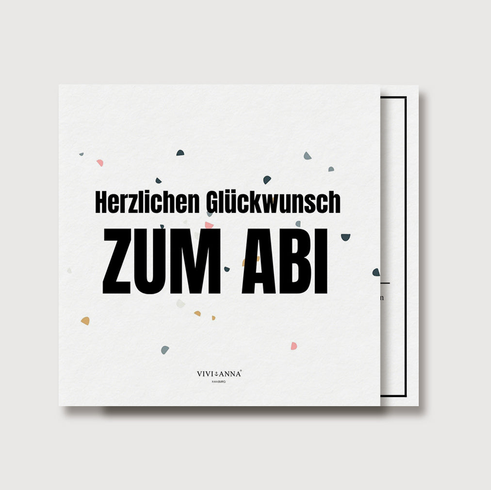 Grußkarte zum Abitur mit Konfetti-Design – Karte mit Umschlag leicht angewinkelt fotografiert