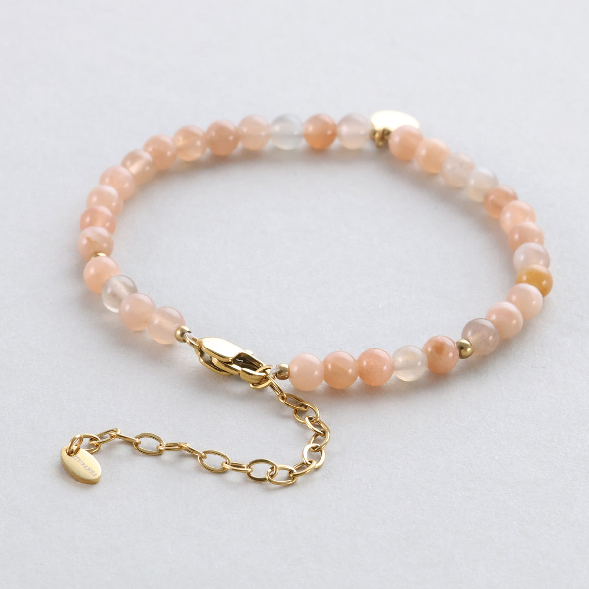 Sonnenstein-Armband mit Karabinerverschluss und Verlängerungskette, Perlen in Beige- und Grautönen