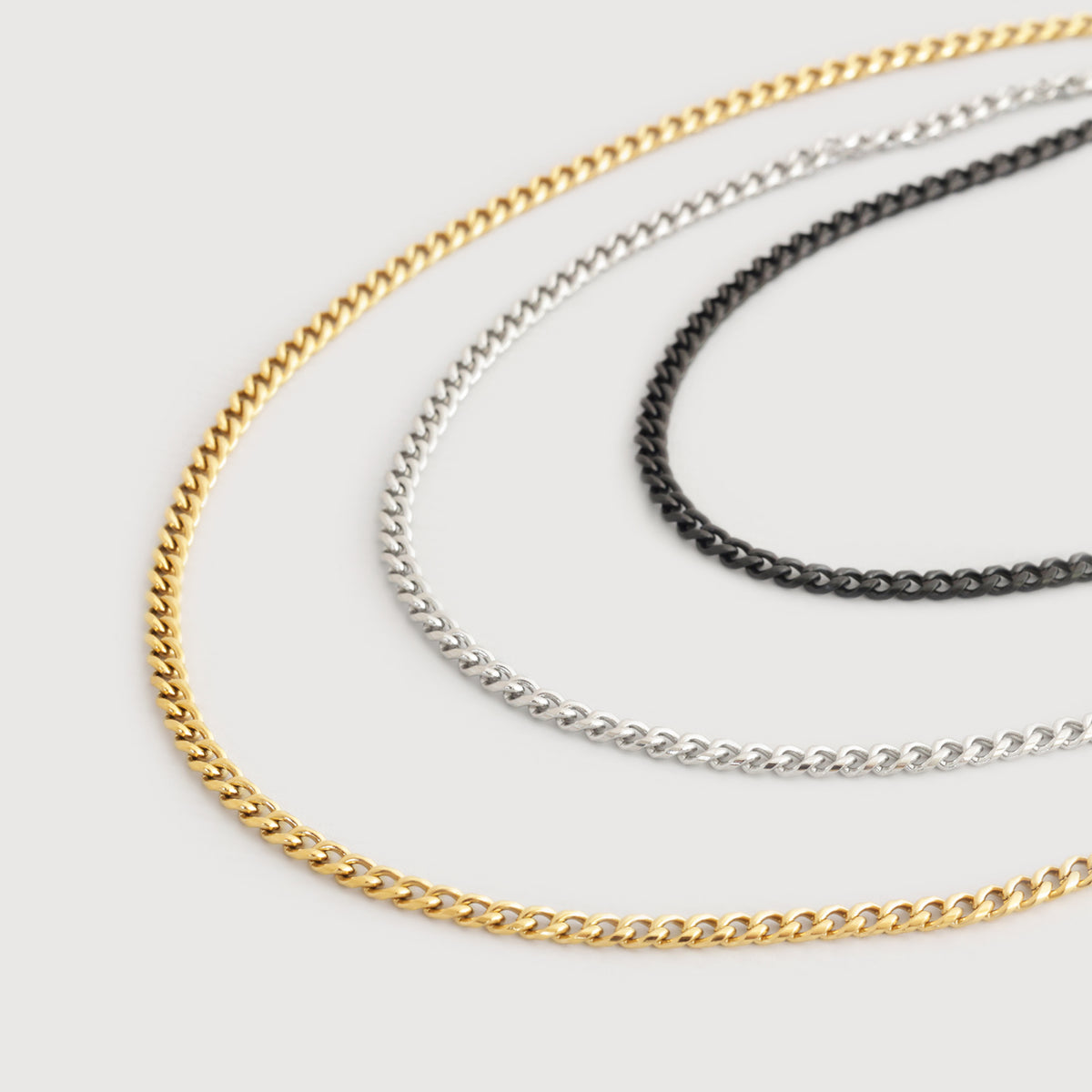 Panzerketten in Gold, Silber und Schwarz nebeneinander in drei Farbvarianten