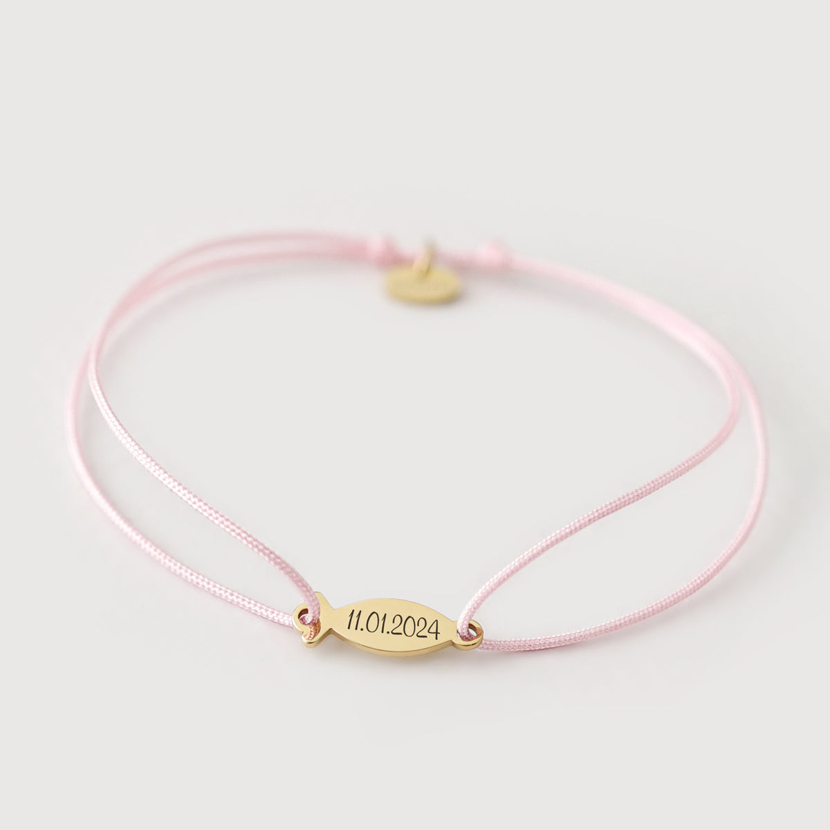 Ichthys Armband mit Gravur in Rosa – Fisch-Plättchen in Gold mit Datum '11.01.2024'